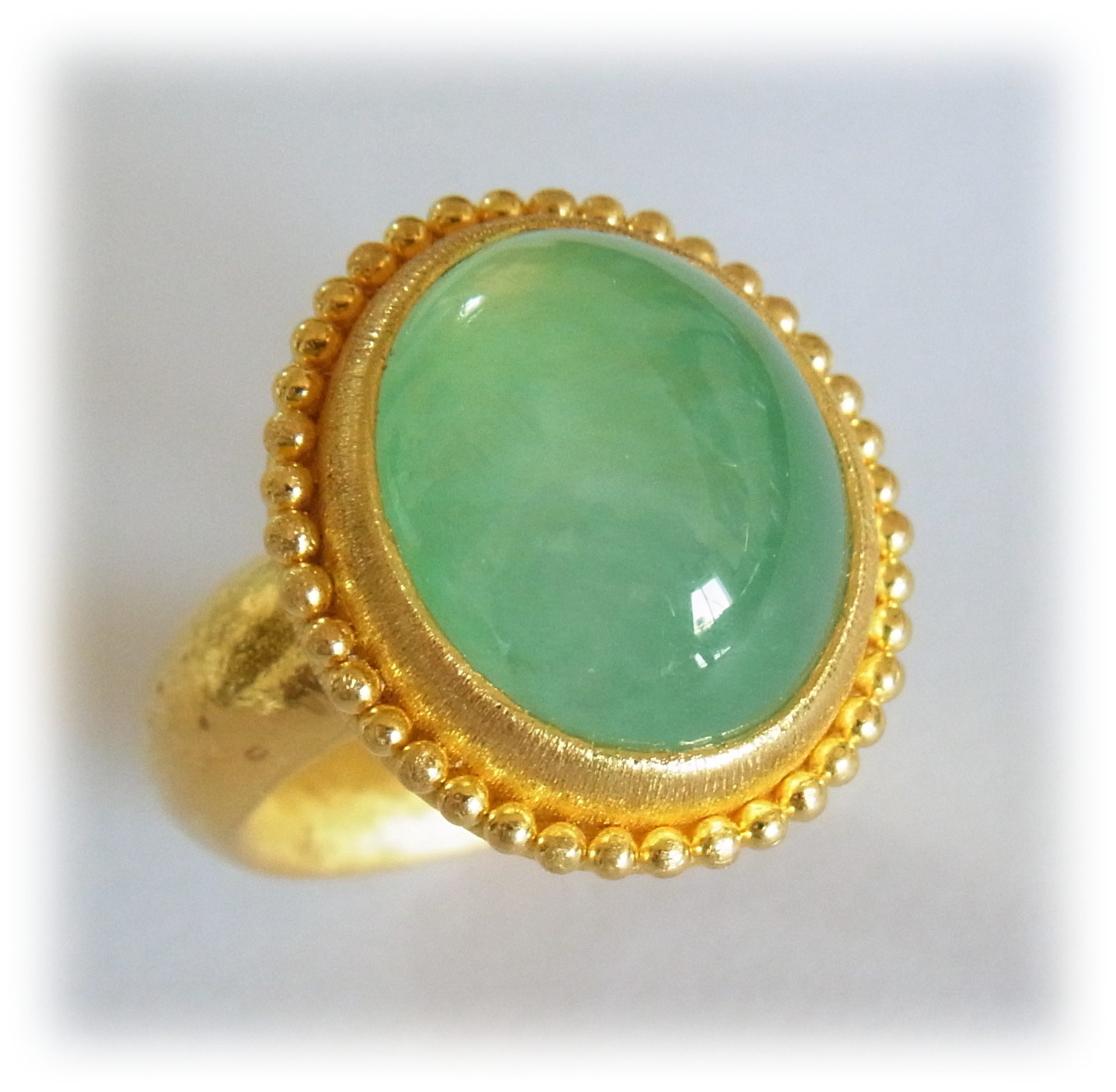 Oval-cabochon Jadeite ring with gold granulation