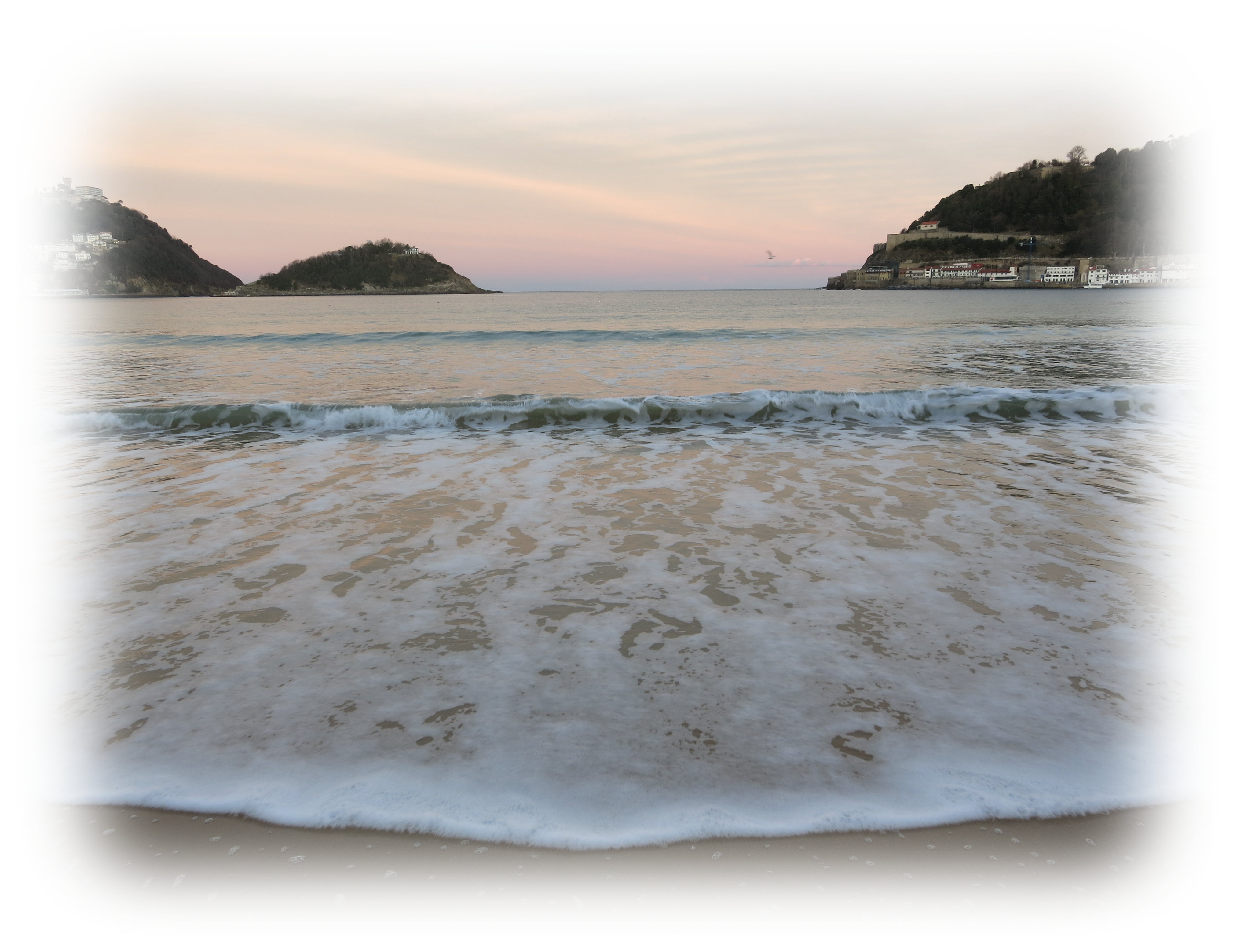 Waves gently lapping on the shores of La Concha Bay of San Sebastián 